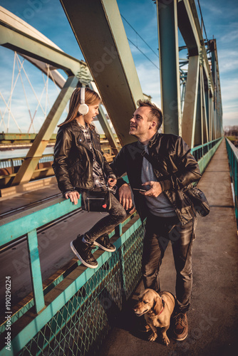 Wallpaper Mural Father and daughter with dog resting on the bridge Torontodigital.ca