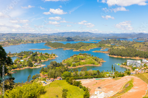 aerial view of the artificial lake of the Penol in a sunny day Guatape