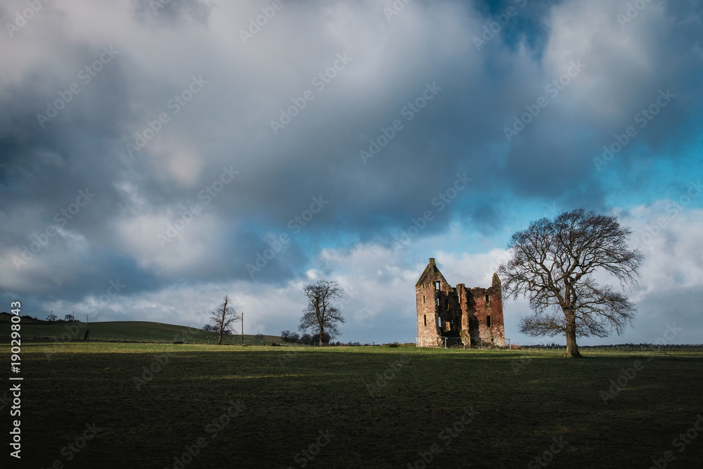 Vintage ruined castle 17th century in the field with trees, Gilbertfield Castle, Glasgow, South Lanarkshire, Scotland