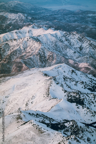Utah's snow covered mountains from an airplane in the afternoon right after a snow storm cleared. 