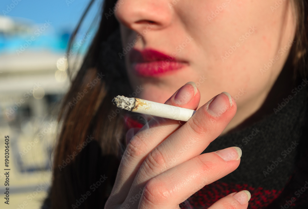 Obraz close up of woman smoking a cigarette fototapeta, plakat