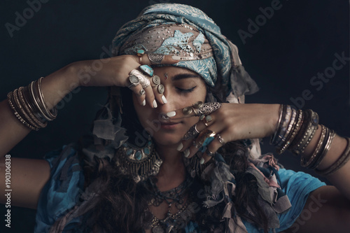gypsy style young woman wearing tribal jewellery portrait photo