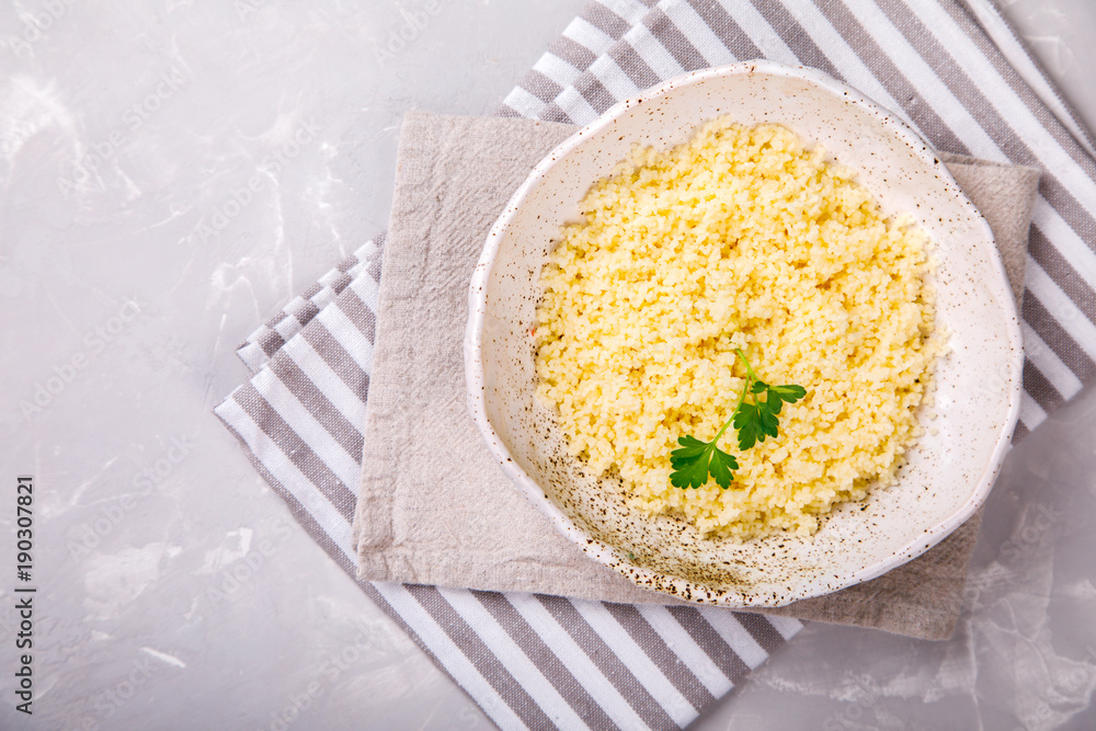 Couscous with parsley in the bowl..Concept of Healthy Food.Food or Healthy diet concept.Super Food.Vegetarian.Copy space for Text. Couscous with parsley in the bowl..Concept of Healthy Food.Food or Healthy diet concept.Super Food.Vegetarian.Copy space for Text.