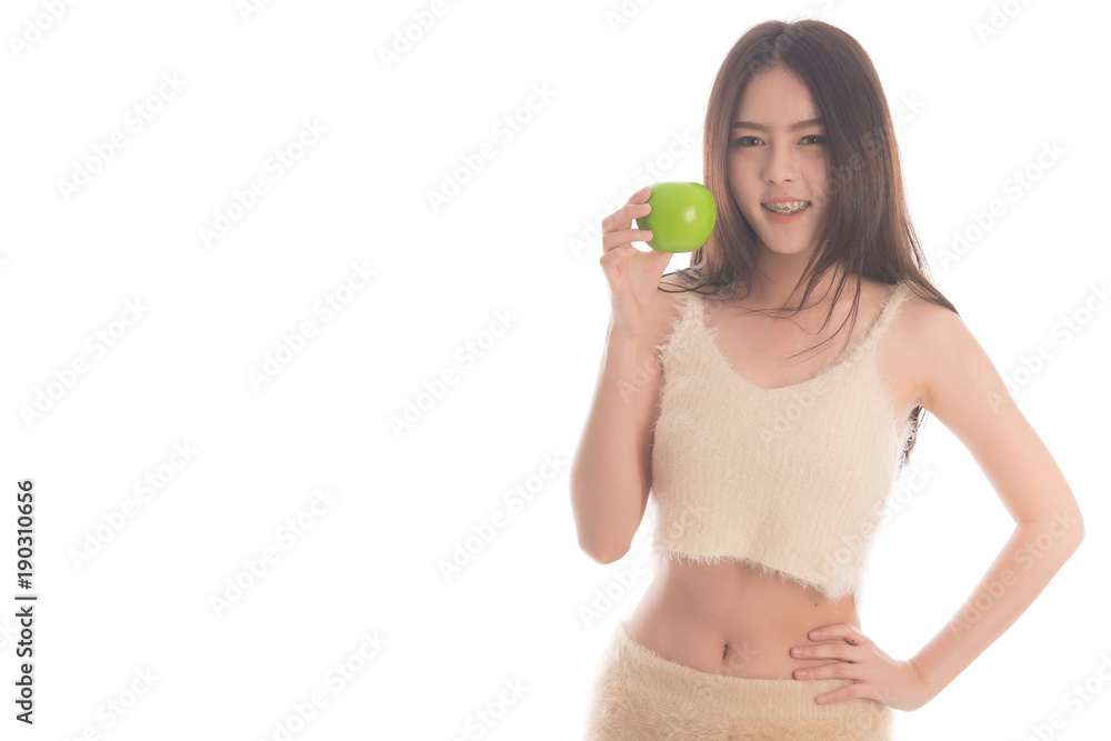 Portrait of asian woman weighting loss l with green apple isolated on white background. weight loss concepts. Free from copy space. Portrait of asian woman weighting loss l with green apple isolated on white background. weight loss concepts. Free from copy space.