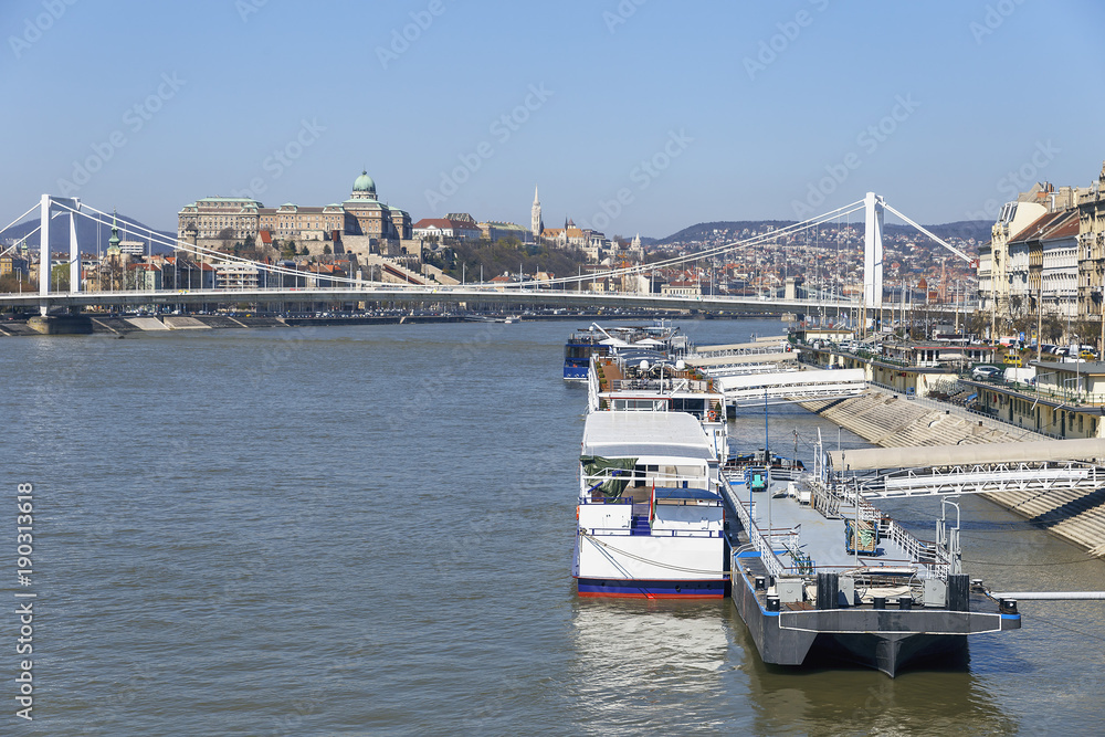 cruise ships at the pier on the Danube, in the background of the historical part of the city