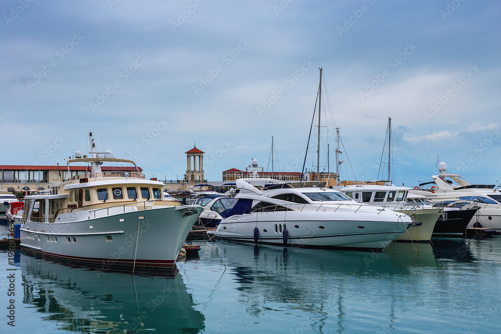 sailing boats in Havana Sochi sea port on a background marine station