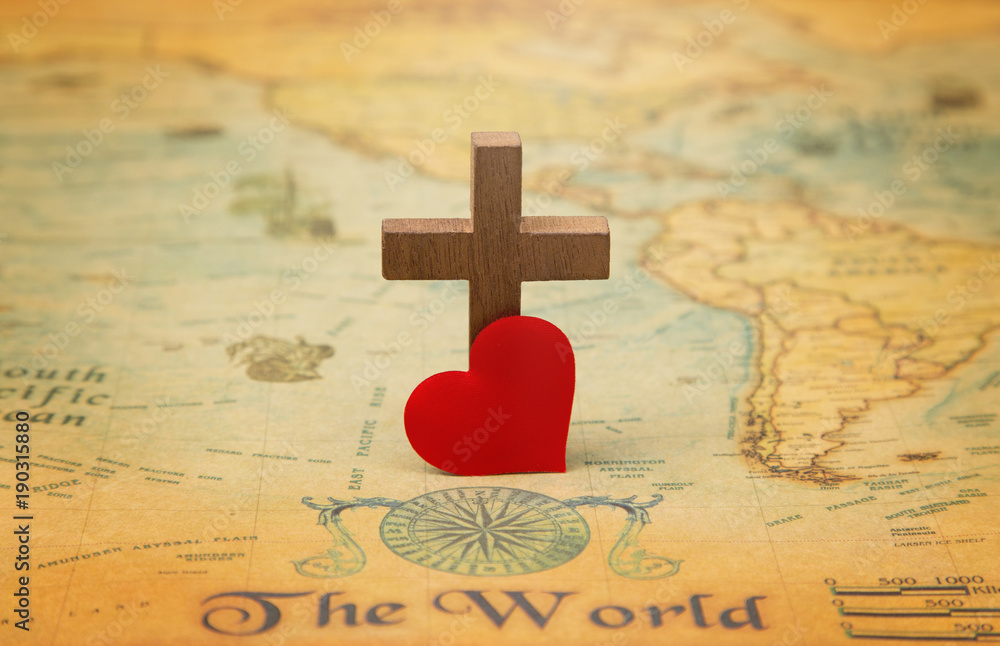 Obraz premium For God so loved the world - A Cross on a rustic world map