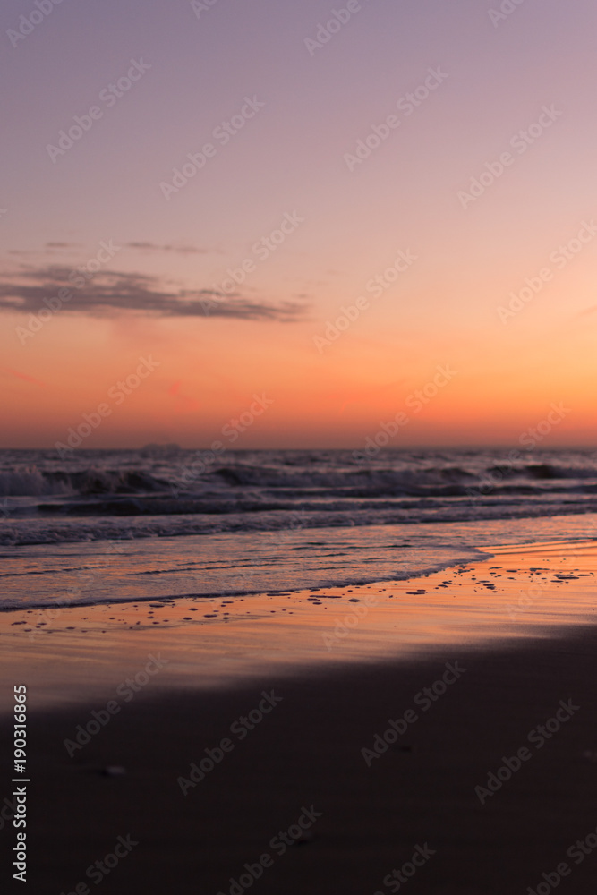 Sunset Reflection on Wet Sand