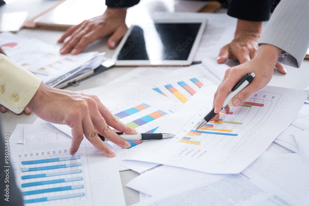 business woman and man discussing a new project using graph for data analysis , business team meenting concept business woman and man discussing a new project using graph for data analysis , business team meenting concept