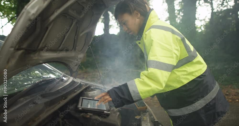 4k, Happy attractive African American female mechanic fixing a broken down car. Slow motion. 4k, Happy attractive African American female mechanic fixing a broken down car. Slow motion.