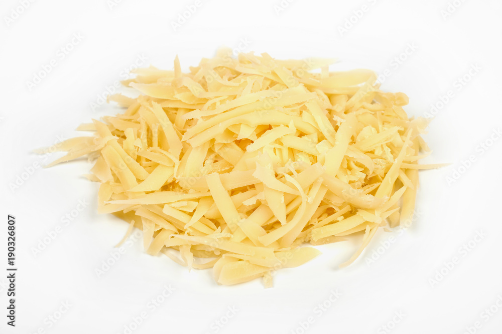 Heap of grated cheese, isolated on white background.