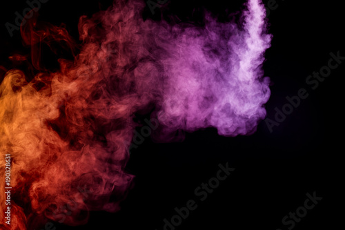 Cloud of smoke of purple, red and orange colors on black isolated background. Background from the smoke of vape