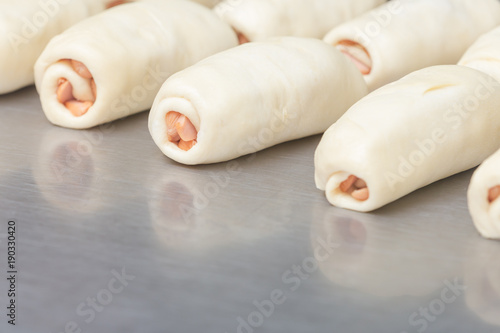 Bakery top view fresh raw dough roll in tray