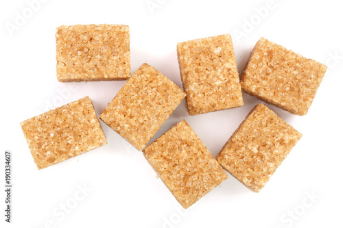 brown sugar cubes isolated on white background. Top view. Flat lay