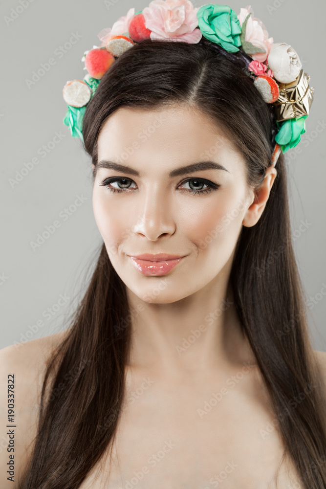 Beautiful Young Woman with Flowers Hairstyle. Blonde Beauty. Fashion Model with Flowers on Head
