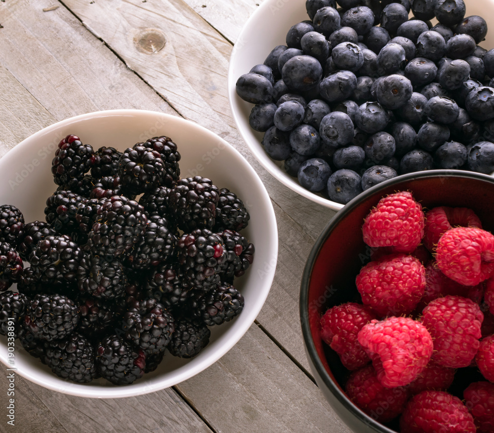 Bowls of fresh fruit; blueberry, raspberry, blackberry Bowls of fresh fruit; blueberry, raspberry, blackberry