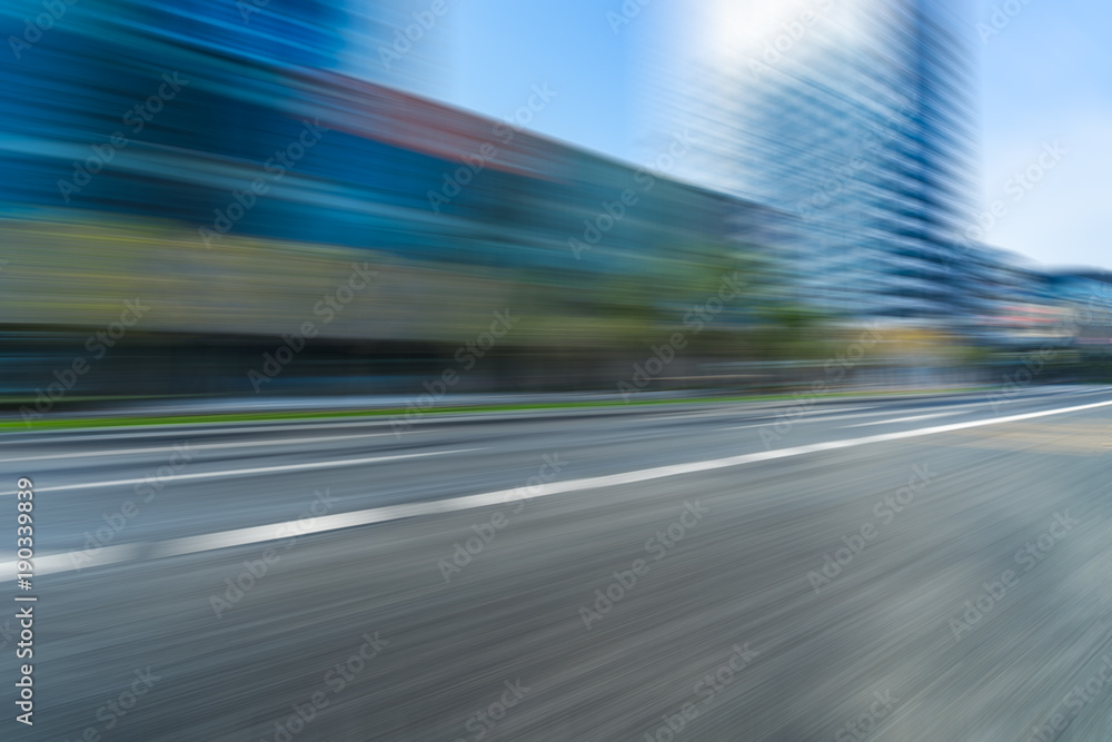 blurred urban road and modern skyline blurred urban road and modern skyline