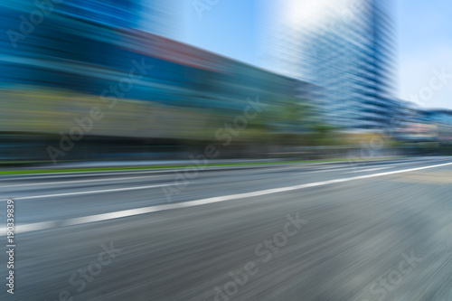 blurred urban road and modern skyline
