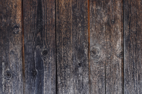 beautiful decorative background with texture of old tarred dark horizontal wooden boards