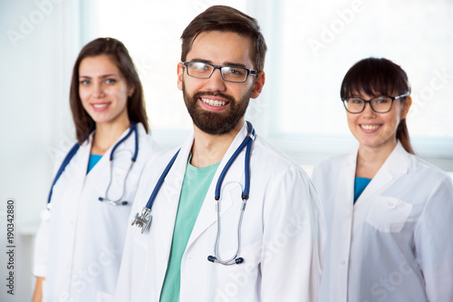 Group of doctors looking at camera and smiling