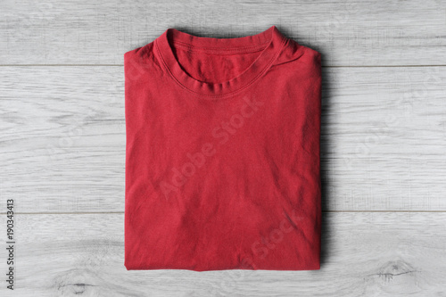 T-shirt on wooden background
