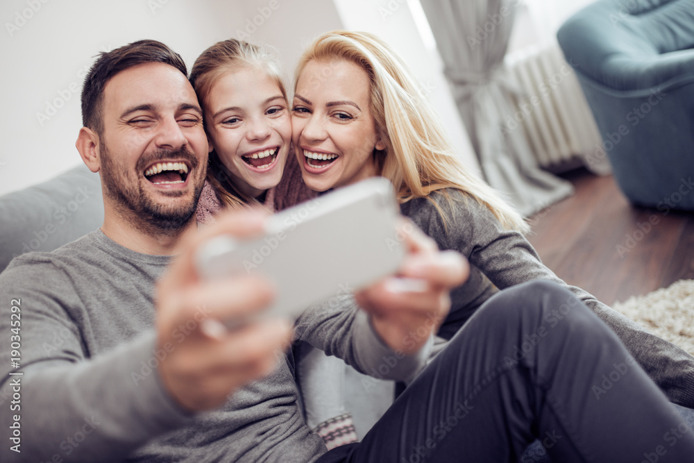 Happy family taking selfie at home Happy family taking selfie at home