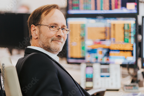 Man working in trading room, stock trader in the office