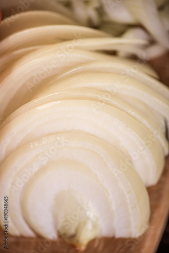 sliced raw onion half rings 