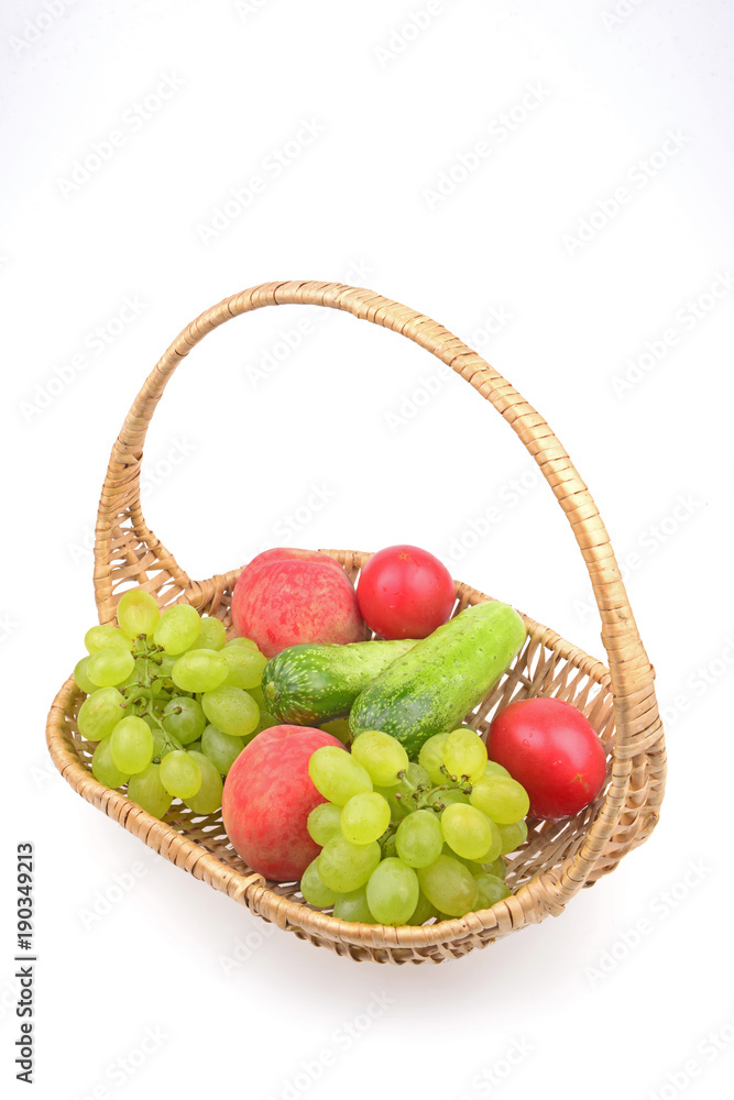 Fruit in the basket isolated on a white background Fruit in the basket isolated on a white background
