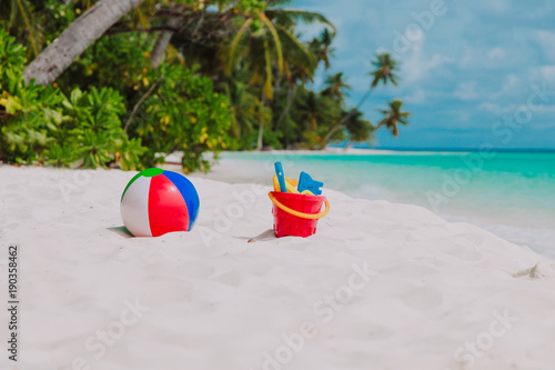 kid toys on tropical sand beach