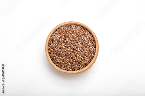 close up of flax seeds on white background. Healthy food concept for preventing heart diseases and overweight.