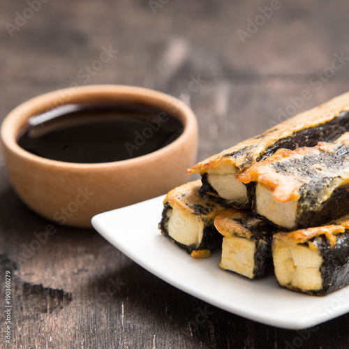 Tofu fried in nori. Served with sauce. Japanese Cuisine. Asian food concept.