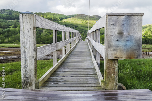 The Jubilee Bridge close to castle Stalker in Appin with breathtaking view of mountains in the background