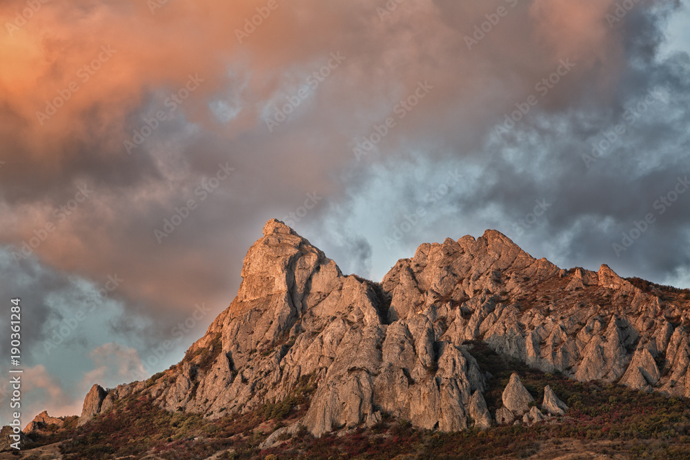 Rocks of the extinct volcano KaraDag in autumn sunset