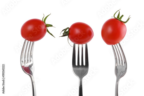 Tomato on a fork isolated on white