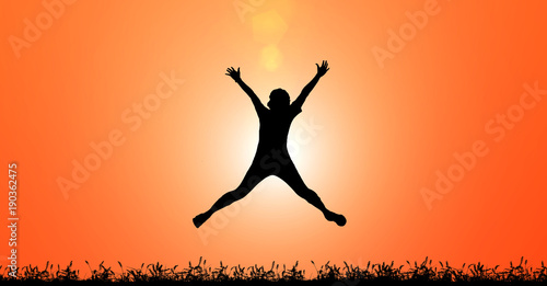 Silhouette woman jumping for joy and happiness on sunset