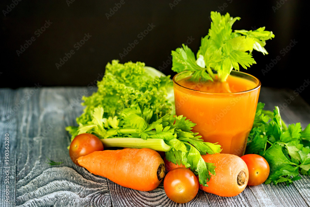 Healthy diet, glass of carrot juice and vegetables Healthy diet, glass of carrot juice and vegetables