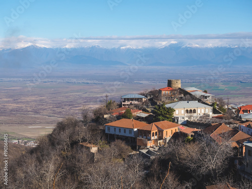 aerial view of buildings and beautiful mountains in Signagi, Georgia