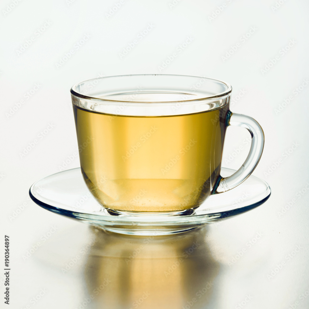 Glass cup of green tea. Close up. Isolated. Glass cup of green tea. Close up. Isolated.