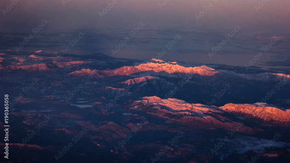 Beautiful Landscape of Mountains. View from the airplane window