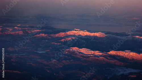 Beautiful Landscape of Mountains. View from the airplane window