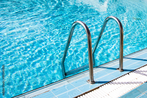 Clear transparent pool water and railings