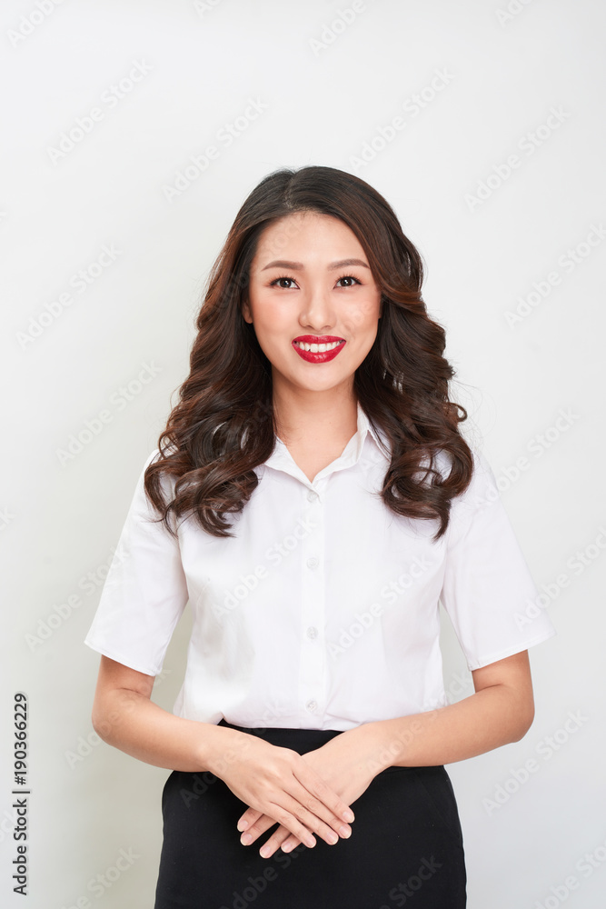 Beautiful happy asian young smiling business woman in white shirt and skirt holding Beautiful happy asian young smiling business woman in white shirt and skirt holding