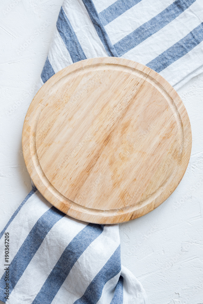 Empty wooden platter on white table