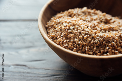 Bowl with bulgur. Uncooked