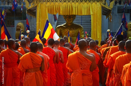 Meak Bochea Day in Cambodia, buddhist monks praying in front of a temple in Phnom Penh.