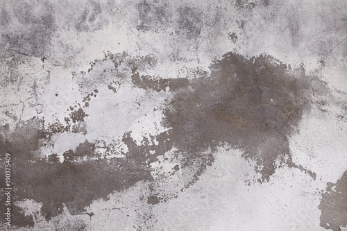 Old concrete wall with cracks. Aged cracked plaster wall background and textu...