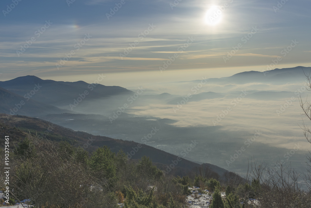 Fototapeta premium Panoramic view with the sunrise from the snowy mountain of Kaimaktsalan (Voras) in Macedonia Greece