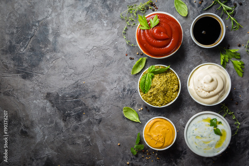 Selection of different sauces in bowls photo