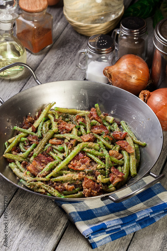 Healthy sauteed green beans with bacon, onion, and bread crumbs